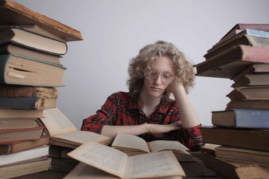 bored teen boy preparing for exam