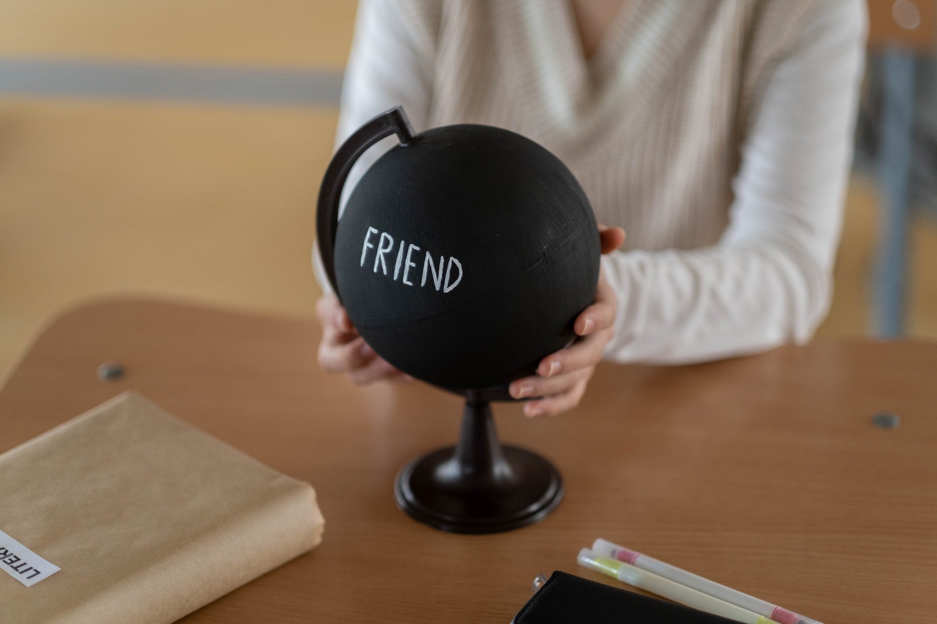 black round plastic container on brown wooden table