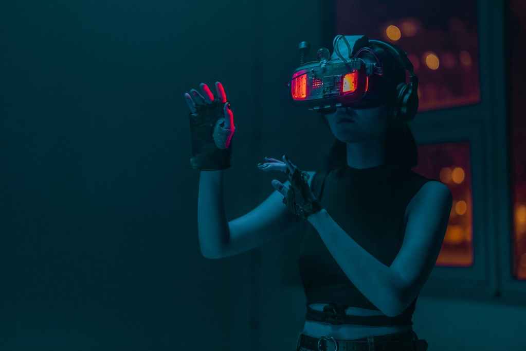 a person doing hand gestures while wearing a vr goggles
