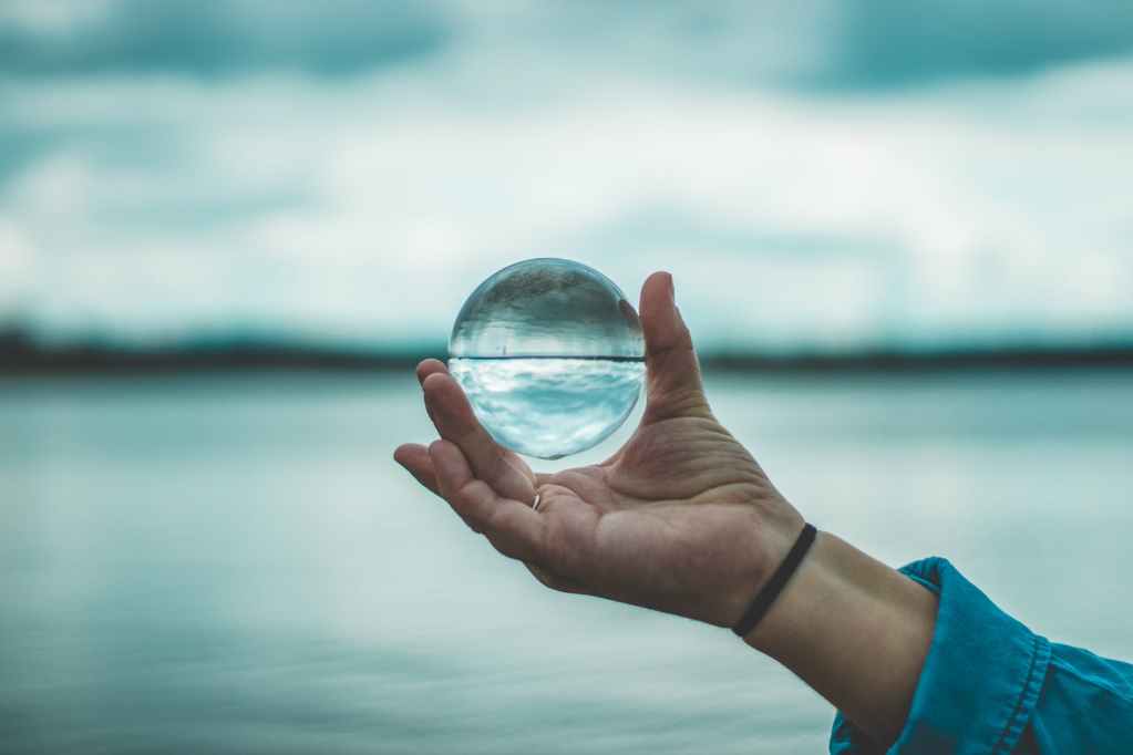 photo of person holding lensball