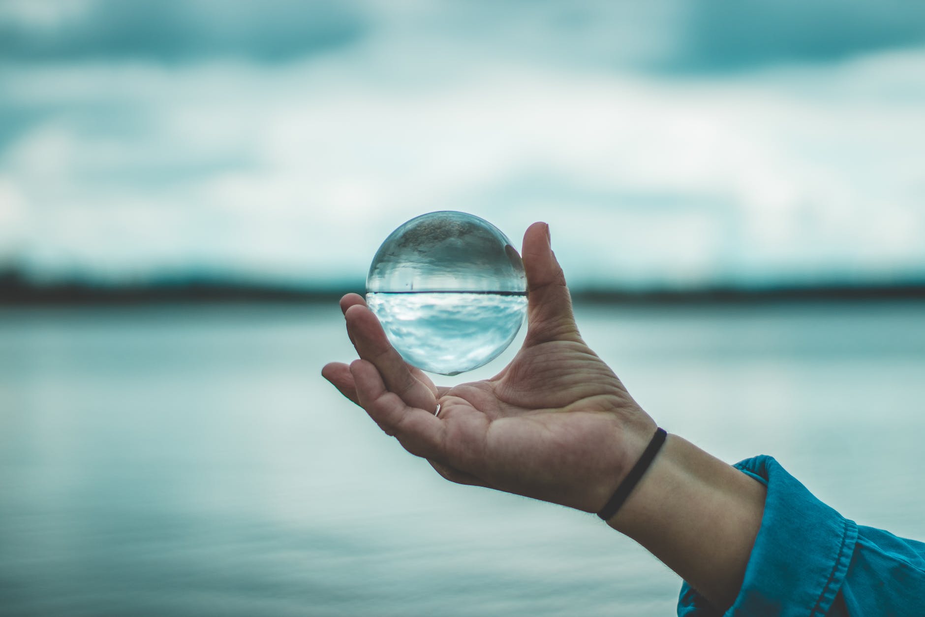 photo of person holding lensball