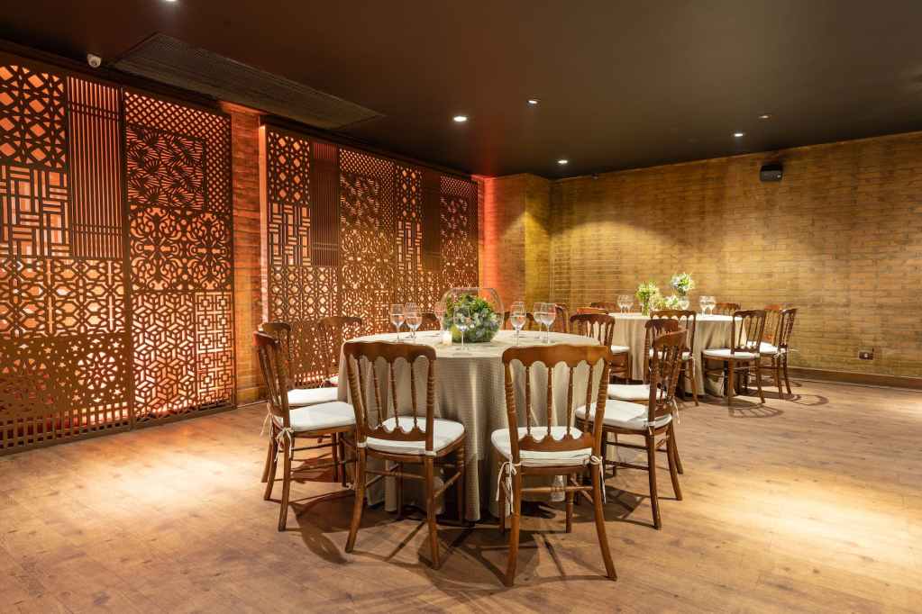 lights over tables and chairs in restaurant