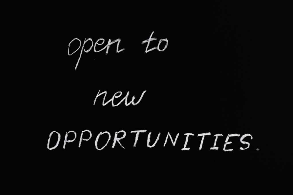 open to new opportunities lettering text on black background