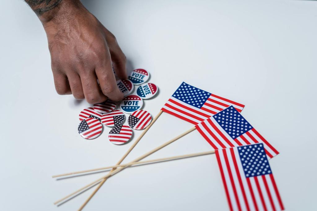american flags and pins on white background